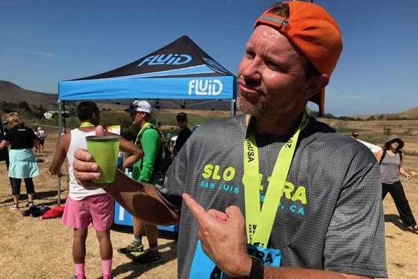 Jim Harman shows off his reusable cup