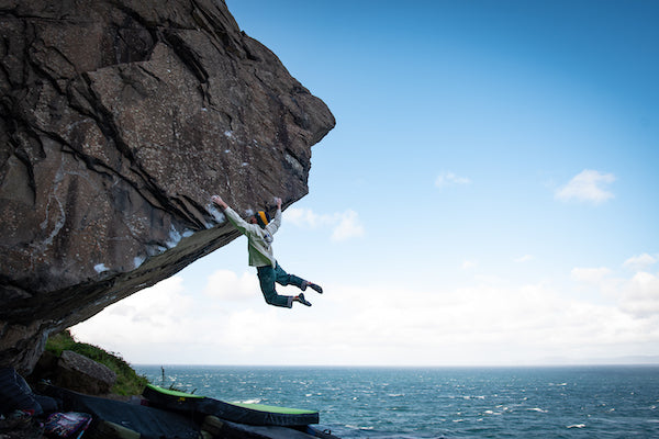 Keenan Takahashi bouldering above the North Atlantic