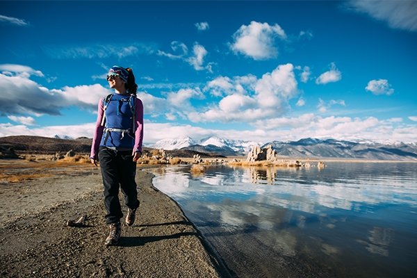 Hiker walking along lake