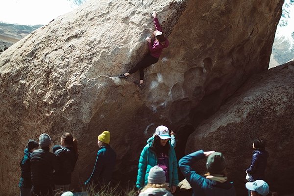 Climbers observing someone bouldering