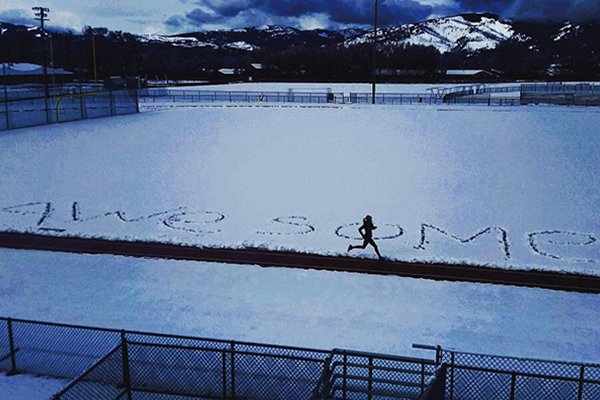 Meredith Edwards running by 'awesome' written into snow