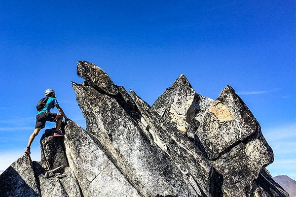 Nick Elson scrambling to the summit