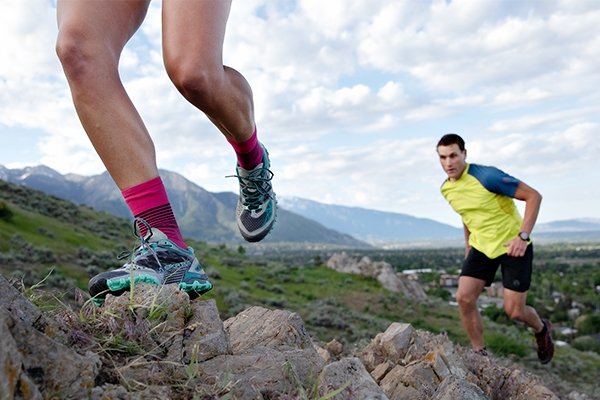 Two runners heading uphill