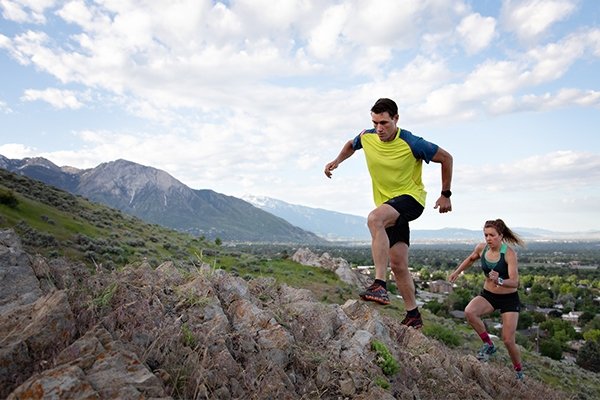 Adam and friend running uphill