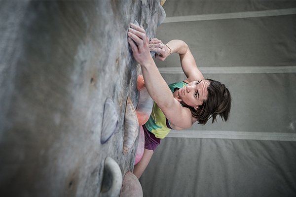Climber bouldering in the gym