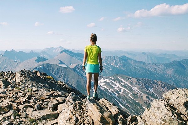 Kristina Pattison standing on summit