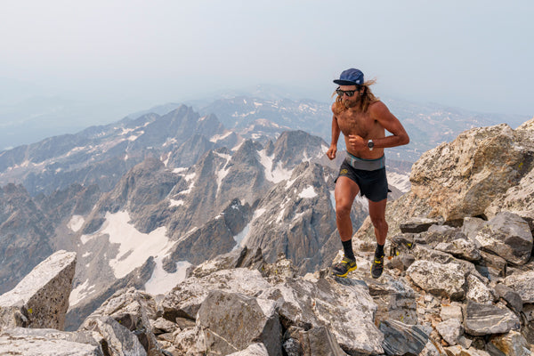 Anton Krupicka running along summit