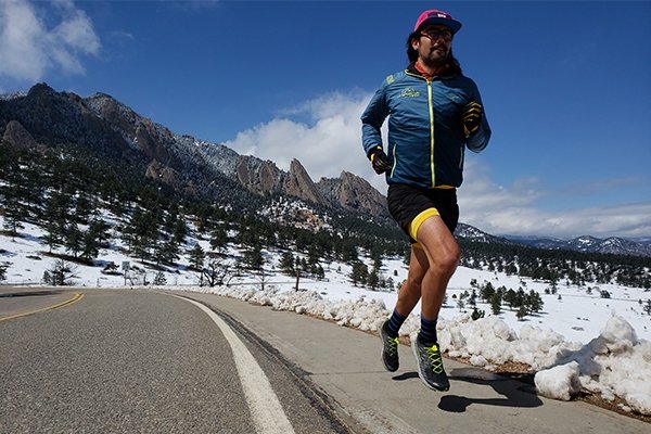 Runner in La Sportiva gear near flatirons