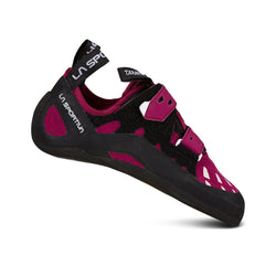 Un seul chausson d'escalade La Sportiva Tarantula pour femme, de couleur marron et noire, avec des bandes Velcro, une semelle en caoutchouc, et marqué sur la bande du talon et sur le côté, est présenté sur un fond blanc.