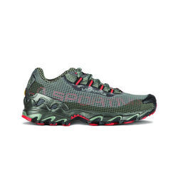 A side view of the La Sportiva Wildcat Women's mountain running shoe in green and black with red accents, showing a textured mesh upper, rugged sole for trail protection, and La Sportiva branding on the side.