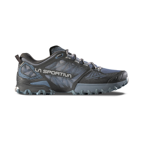 The La Sportiva Bushido III Wide Women's mountain running shoe in black and blue features rugged tread, lace-up closure, and mesh details for trail runners, shown from the side on a white background.