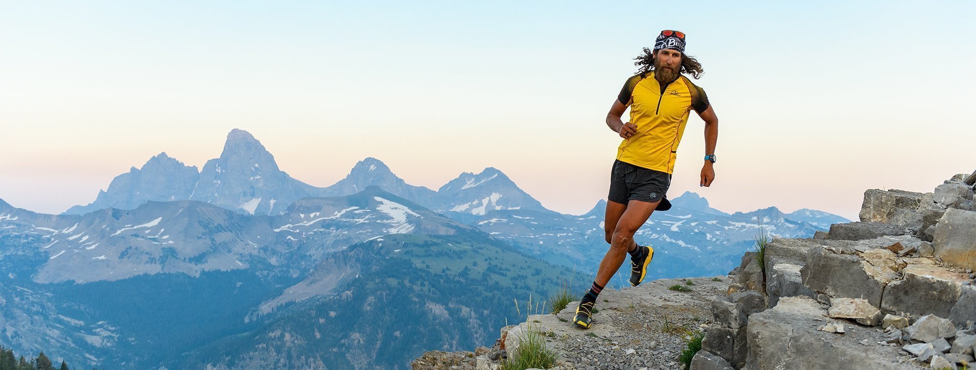 Person running on a mountain with scenic view