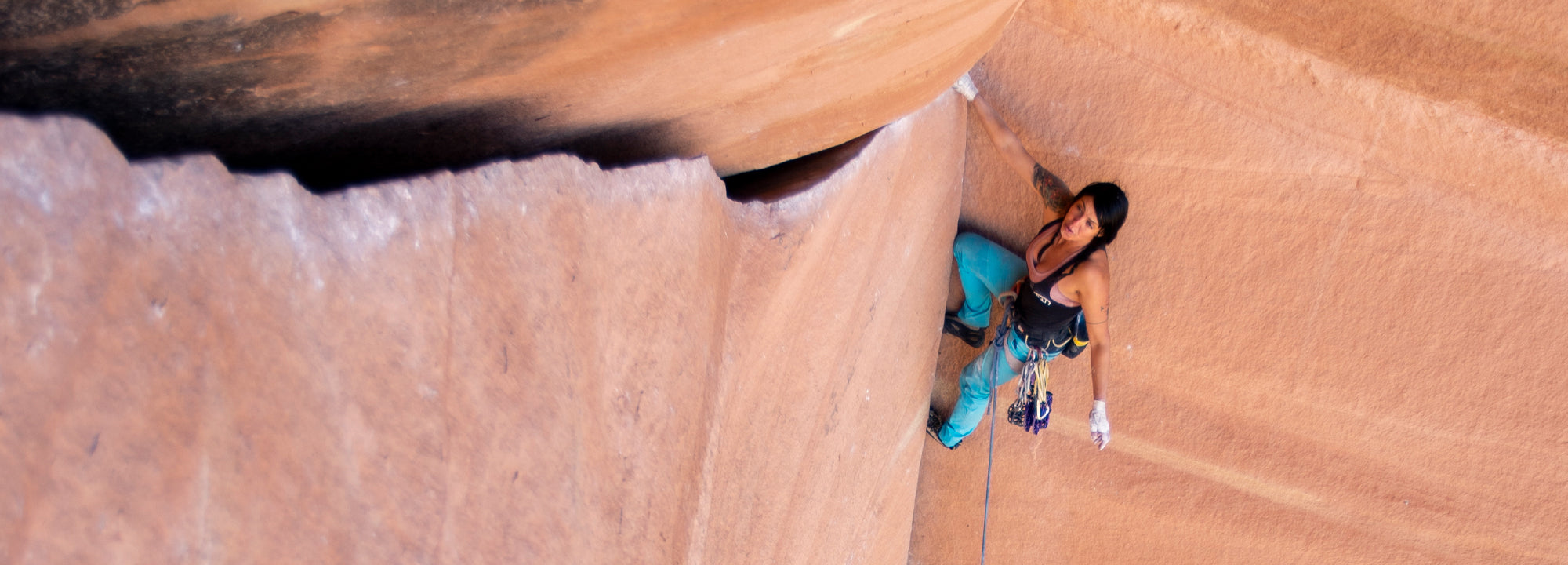 Person rock climbing on a sandstone wall