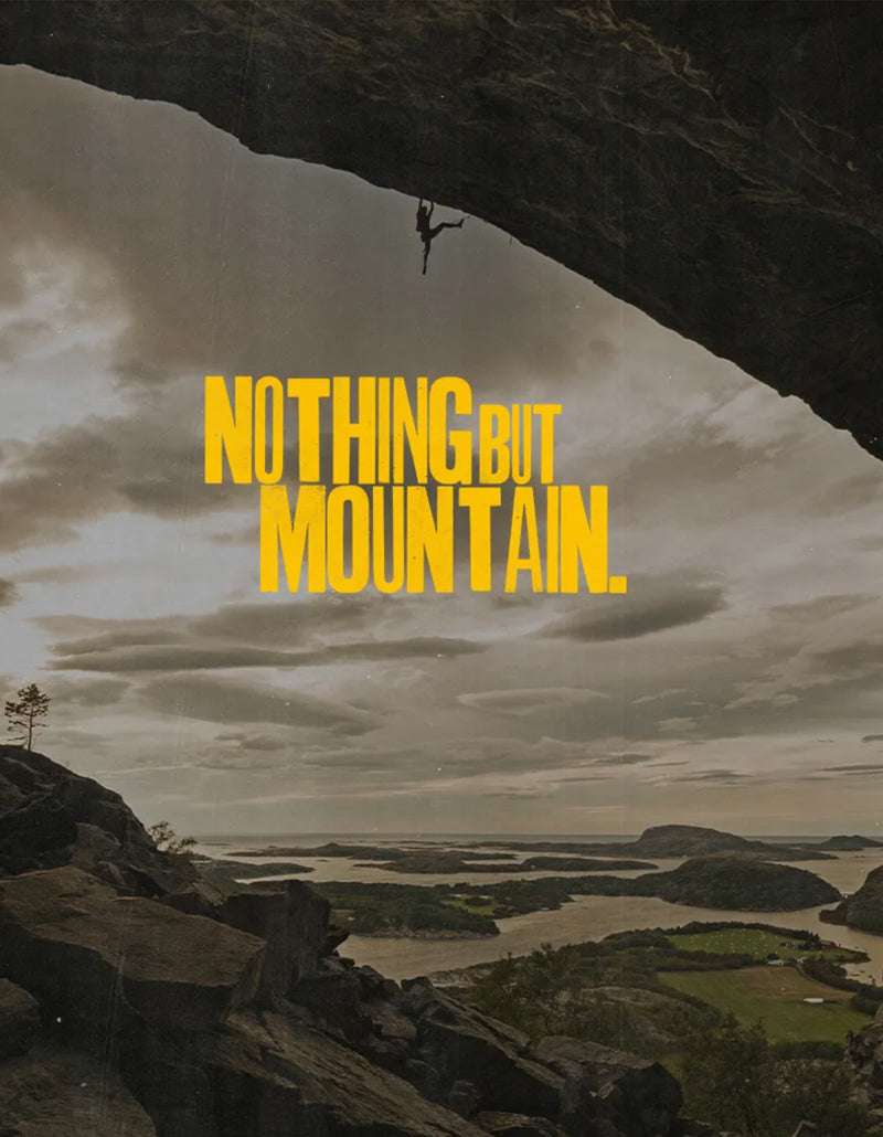 A rock climber on a cliff with a text overlay that says "Nothing but Mountain."