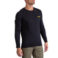 A man wearing the La Sportiva Climbing on the Moon Sweatshirt in black, featuring a small yellow logo on the left chest, and olive green pants, stands against a white background.