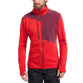 Un homme aux cheveux frisés et à la barbe porte le La Sportiva Lucendro Thermal Hoody Men's, une veste zippée rouge et bordeaux avec un col montant et une poche sur la poitrine, sur fond blanc.