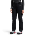 Une personne porte le pantalon La Sportiva Helixir 3L Shell pour femme, associé à un haut à manches longues gris foncé et à des chaussures de sport grises rehaussées de touches de rose et de bleu sarcelle, debout devant un fond blanc uni. Ce pantalon imperméable est un élément indispensable de l'équipement d'alpinisme signé La Sportiva, alliant avec brio style et protection hautement performante.
