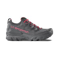 The La Sportiva Ultra Raptor 3 GTX Women's hiking shoe is gray with pink accents, including the brand name and laces. It features Gore-Tex technology and is displayed on a white background.