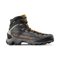 The La Sportiva Aequilibrium Hike GTX is a black and orange mid-cut boot with rugged tread, high ankle support, abrasion-resistant materials, orange laces, and bold La Sportiva branding on the side.