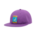 The La Sportiva Climbing on the Moon Hat is a purple climbing hat featuring a rectangular patch on the front that depicts a climber on the moon surrounded by stars, along with the text ASPORTUTA and CLIMBING ON THE MOON. It’s perfect for those who dream big and love adventure.