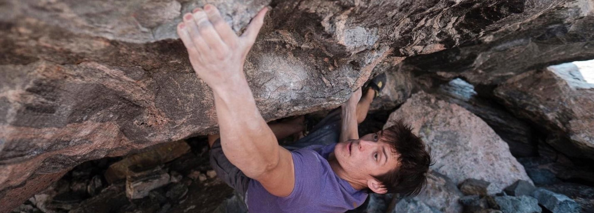 Person rock climbing on a rocky wall
