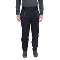 A person wearing La Sportiva Crizzle EVO Shell Pants Men’s, featuring black hardshell fabric with yellow accents, a long-sleeve dark shirt, and cycling shoes—standing facing forward against a white background.